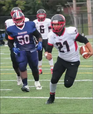  ?? File photo ?? Jason DelaCruz (21, above) and the No. 2 Tolman football team heads to East Greenwich High School today to face No. 3 Pilgrim in the Division III semifinals.