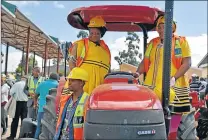  ?? Picture: SUPPLIED ?? BRAND NEW: Chris Hani mayor Kholiswa Vimbayo and Engcobo mayor Lizeka Tyali test a new tractor at a handover