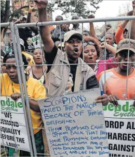  ??  ?? Loyalists: Supporters of then deputy president Jacob Zuma outside the Pietermari­tzburg high court on August 5, 2008, when he was on trial for corruption. The charges were later dropped. Photo: Rogan Ward