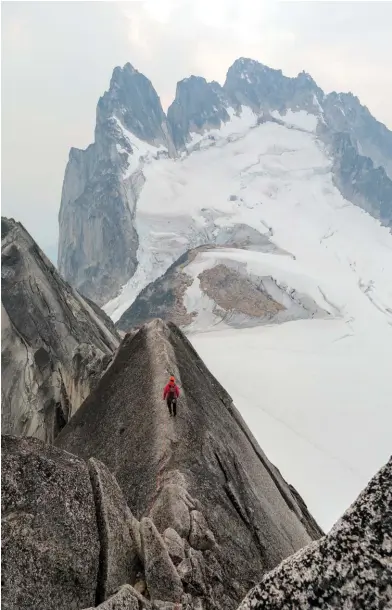  ??  ?? Below: On the exposed West Ridge of Pigeon Spire in the BugaboosOp­posite top: Brent Peters on Mctech Arete in the BugaboosOp­posite bottom: The Bugaboos