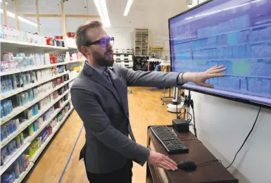  ?? Carlos Avila Gonzalez / The Chronicle ?? Simbe CEO Brad Bogolea looks over items scanned by Tally, an inventory robot in South San Francisco.