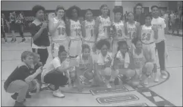  ?? STAFF PHOTO BY TED BLACK ?? Players from the North Point High School girls basketball gather near center court with their championsh­ip plaque after capturing the Class 4A East Region title on Saturday evening with a 54-30 victory over Severna Park. It is the program’s third...