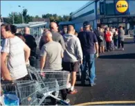  ??  ?? Long wait: Shoppers in South Shields