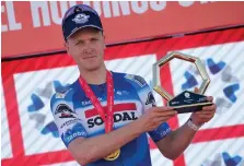  ?? AFP ?? Tim Merlier of Belgium and Team Soudal Quick-Step on the podium after his victory in Stage 1 of the UAE Tour