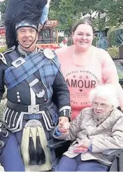  ??  ?? Happy days Margaret Whitelaw and Gemma Downie meet the Gretna Green piper who played for Liz and Philip