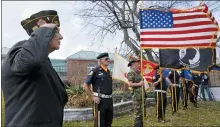  ?? CHARLES KRUPA— THE ASSOCIATED PRESS ?? Chaplain Charles Andriolo, of VFW Post 1617, salutes during a Veterans Day ceremony in Derry, N.H.