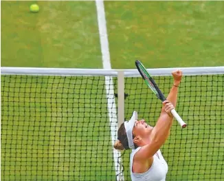  ?? AP PHOTO/BEN STANSALL ?? Seventh-seeded Simona Halep celebrates after beating eighth-seeded Elina Svitolina in a semifinal match Thursday at Wimbledon. Halep won 6-1, 6-3 to reach a final at the All England Club for the first time.