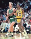  ?? ANDREW D. BERNSTEIN, NBAE/GETTY ?? Larry Bird, left, and Magic Johnson met in the NBA Finals three times.