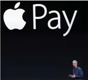  ?? MARCIO JOSE SANCHEZ — THE ASSOCIATED PRESS FILE ?? Apple CEO Tim Cook introduces the new Apple Pay product in Cupertino.