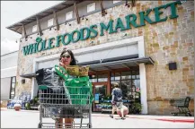  ?? RICARDO B. BRAZZIELL / AUSTIN AMERICAN-STATESMAN ?? Whole Foods Market has a new system asking shoppers to rate their experience at checkout; a move that has employees worried about impacting evaluation­s.