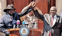  ?? AFP ?? SOUTH Sudanese President Salva Kiir, left and South Sudan’s opposition leader Riek Machar, right, hold hands during a media briefing after their peace talk at the State House in Juba, South Sudan, on December 17, 2019. |