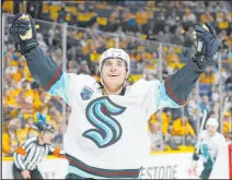  ?? Mark Humphrey The Associated Press ?? Kraken left wing Brandon Tanev celebrates after scoring a first-period goal Thursday in Seattle’s 4-3 win over the Predators at Bridgeston­e Arena.