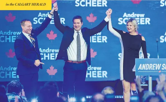  ?? ANDREW VAUGHAN / THE CANADIAN PRESS ?? Former cabinet minister Peter MacKay, left, introduces party leader Andrew Scheer and his wife Jill at the Conservati­ve party’s national policy convention in Halifax on Friday. in the CALGARY HERALD