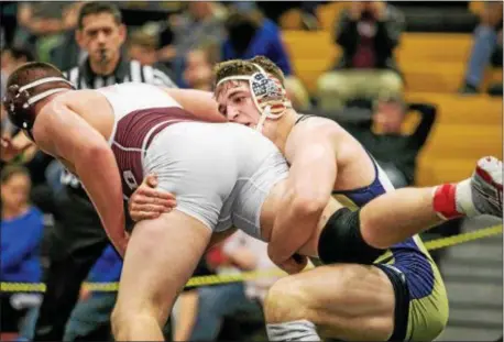  ?? NATE HECKENBERG­ER — FOR DIGITAL FIRST MEDIA ?? Sun Valley sophomore Hunter Catka finishes a takedown major decision in the 220-pound district finals. against Oxford’s Sam Blevins Saturday on his way to a 13-2