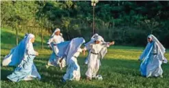  ??  ?? Fellows nun of Maria Valentina de los Angeles play football at a convent.