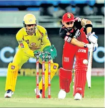  ?? Photos: IPL ?? Virat Kohli (right) did bulk of the scoring for Bangalore, smashing an unbeaten 90