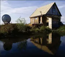  ??  ?? RIGHT: The house is one of the buildings at the Northeast Science Station, where Sergey, Nikita and their families live and work