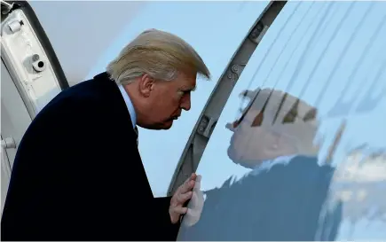  ?? PHOTO: AP ?? President Donald Trump walks up the steps of Air Force One at Andrews Air Force Base in Maryland at the weekend. Trump heads to New York to attend Republican fundraiser­s.