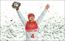  ?? AFP ?? China’s Qi Guangpu performs on his way to winning the freeski men’s aerials gold on Feb 16.