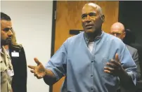  ?? ASSOCIATED PRESS FILE PHOTO ?? Former NFL football star O.J. Simpson reacts after learning he was granted parole July 20 at the Lovelock Correction­al Center in Lovelock, Nev. Members of the Nevada Board of Parole Commission­ers said Simpson had no history of a criminal conviction....