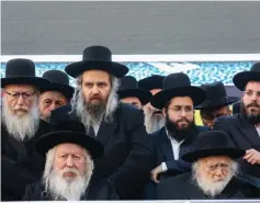  ?? (Noam Revkin Fenton/Flash90) ?? RABBI CHAIM KANIEVSKY (right, sitting), Grand Rabbi Yaakov Aryeh Alter of the Gur Hassidic Dynasty (left, sitting) and UTJ head Ya’acov Litzman attend the party’s rally in Jerusalem yesterday.