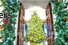  ??  ?? The 2020 official White House Christmas tree displayed in the Blue Room is a Fraser fir from Shepherdst­own, W.Va, trimmed with more than 160 artworks created by students from each state and territory depicting something that captures the spirit of their state.