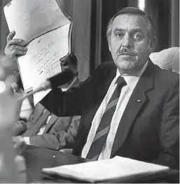  ?? Picture: Daniel Simon ?? Pik Botha, in November 1986, holds up evidence retrieved from the Samora Machel air disaster which he said incriminat­ed Zambia, Zimbabwe and Mozambique jointly in a plot to overthrow the Malawian government of president Hastings Banda.