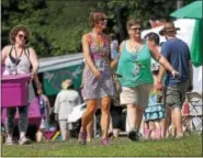  ?? GENE WALSH — DIGITAL FIRST MEDIA ?? Vendors arrive with the products at the 56th annual Philadelph­ia Folk Festival in Upper Salford on Aug. 17.