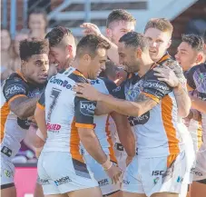  ??  ?? Benji Marshall and Luke Brooks celebrate with their teammates.