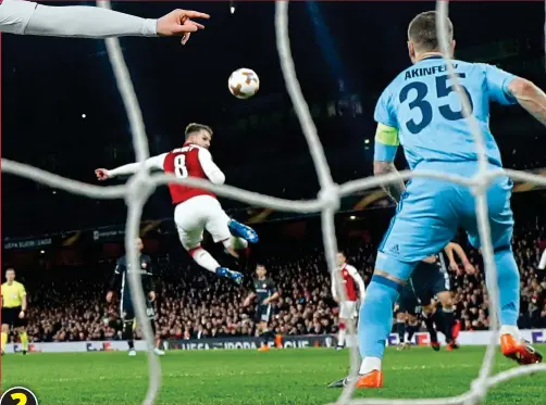  ??  ?? ... the Arsenal midfielder executes a flying back heel — or ‘mule kick’ — as he leaps through the air