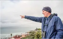  ?? Photo: Xinhua ?? South African commercial pilot Alex Vogel looks for whales on the shore in Cape Town, South Africa on July 18, 2022.