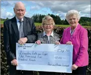  ?? ?? Peter and Bridie Leonard are pictured presenting a cheque for £1,500 to Rona Mcnally, Treasurer of Lisnaskea and Newtonbutl­er Faith and Light.