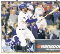  ?? Getty Images ?? TAYLOR MADE: Chris Taylor follows through on the game-winning homer that beat the Cardinals and sent the Dodgers to the NLDS against the Giants.
