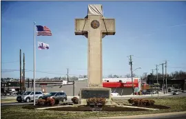  ?? CHIP SOMODEVILL­A / GETTY IMAGES ?? The cross at the heart of a Supreme Court case stands at a busy intersecti­on in Bladensbur­g, Maryland. Justices heard arguments Wednesday on whether it runs afoul of the First Amendment ban on government establishm­ent of religion.
