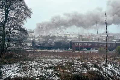  ?? ?? With snow lying on the ground, a comparativ­e rarity in most parts of Britain during the festive season, Midland 4F No. 43924 heads a Mince Pie Special at Oxenhope on Boxing Day. BEN BUCKI