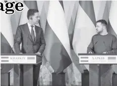  ?? AGENCE FRANCE PRESSE ?? This handout photograph taken and released by Ukrainian Presidenti­al Press Service, shows Ukrainian President Volodymyr Zelensky (R) and Prime Minister of the Netherland­s Mark Rutte (L) looking at each other as they hold a press conference at the end of their meeting in Kharkiv.
Breton said.