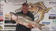  ?? SUBMITTED PHOTO ?? Lorain angler James Beres, 47, displays the Ohio state record lake trout he caught off Lorain on Dec. 1.