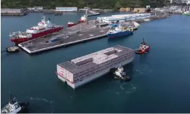  ?? Photograph: Ben Birchall/PA ?? The Bibby Stockholm barge being manoeuvred into the dock at Portland, Dorset, where it is due to house migrants, 18 July 2023.