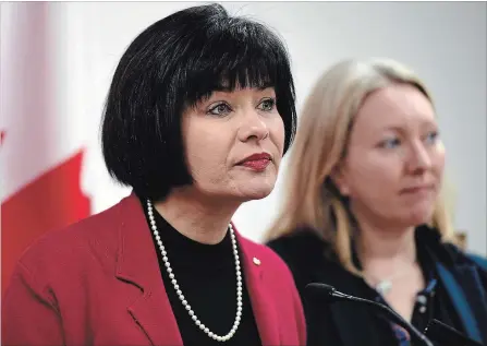  ?? JUSTIN TANG THE CANADIAN PRESS ?? Health Minister Ginette Petitpas Taylor listens to a question during the announceme­nt as Liberal MP for Ottawa-Vanier Mona Fortier looks on.