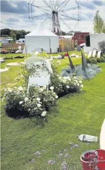  ??  ?? ●● Jon Tilley (inset) from Macclesfie­ld creating his design ‘Life is a Garden Path’ at the RHS Tatton Flower Show