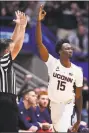  ?? Jessica Hill / Associated Press ?? UConn’s Sidney Wilson reacts after making a 3-pointer during Sunday’s game against Arizona at the XL Center in Hartford.