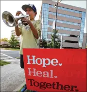  ?? CURTIS COMPTON / CCOMPTON@AJC.COM ?? Renfroe Middle School sixth-grader plays show tunes and classical music Wednesday outside Emory Decatur Hospital. He agreed to a special request from the hospital: to play at various times so more staff, who work varied hours, can enjoy his music.