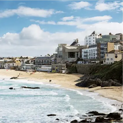  ??  ?? Previous page Architect Jamie Fobert. Above The £20 million Tate St Ives extension sits among the shops and homes overlookin­g Porthmeor Beach. Above right Six skylights jut out of the ground, surrounded by Cornish stone