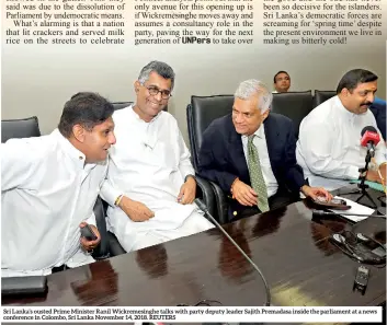  ??  ?? Sri Lanka’s ousted Prime Minister Ranil Wickremesi­nghe talks with party deputy leader Sajith Premadasa inside the parliament at a news conference in Colombo, Sri Lanka November 14, 2018. REUTERS