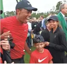  ?? ROB SCHUMACHER/USA TODAY SPORTS ?? Tiger Woods celebrates with daughter Sam and son Charlie after winning the Masters last year.