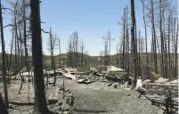  ?? JEFFREY D. ALLRED/THE DESERET NEWS VIA AP ?? A home was completely destroyed by the wildfire at Brian Head in Utah on Friday. Hundreds of people forced from their southern Utah homes near the country’s largest active wildfire headed home Friday and prepared for a subdued Fourth of July...