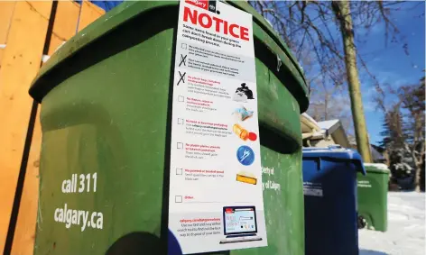  ?? GAVIN YOUNG ?? Waste and recycling crews have been performing checks on about 5,000 blue and green bins annually for the past number of years.