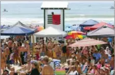  ?? JOHN ALTHOUSE /THE JACKSONVIL­LE DAILY NEWS VIA AP ?? In this 2016 photo, festival-goers watch performanc­es at the Emerald Isle, N.C., Beach Music Festival. A 2004 law mandating when North Carolina public schools hold summer vacation is facing its strongest challenge yet from educators and legislator­s who...