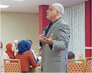  ??  ?? Imad Enchassi, senior imam and founder of the Islamic Society of Greater Oklahoma City, discusses the tenets of Islam at a “Ramadan Fast-Breaking Dinner” hosted by the Dialogue Institute of Oklahoma City on June 13 at the Raindrop Turkish House, 4444 N...