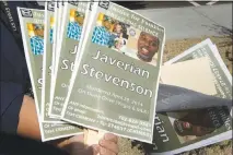  ??  ?? Posters featuring images of Javerian Stevenson are displayed during last week’s rally.